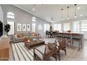 Bright and airy living room featuring modern decor, vaulted ceilings, and an open floor plan at 372 W Larona Ln, Tempe, AZ 85284