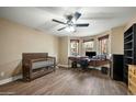 Bright bedroom with hardwood floors, ceiling fan, bay window, and office space at 567 W 6Th St, Tempe, AZ 85281