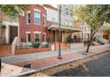 Charming townhome features a brick facade, covered porch, and inviting front entrance at 567 W 6Th St, Tempe, AZ 85281