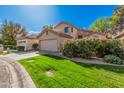 Single-Gathering home featuring a well-maintained lawn, a two-car garage, and mature landscaping at 73 E Caroline Ln, Tempe, AZ 85284