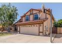 Beautiful home with a red tile roof, and a basketball hoop above the driveway at 956 N 58Th St, Mesa, AZ 85205