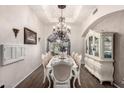 Dining room with decorative lighting, a china cabinet, and a large dining table with seating at 1954 E Vista Dr, Phoenix, AZ 85022