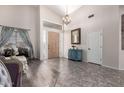 Entryway featuring wood floors, high ceilings, chandelier, statement wall decor and furniture at 1954 E Vista Dr, Phoenix, AZ 85022