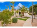 Inviting home exterior showcasing lush landscaping, a well-maintained lawn, and a welcoming entrance at 2878 E Tonto Dr, Gilbert, AZ 85298