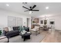 Contemporary living room featuring modern furniture, wood floors, and a stylish ceiling fan at 3407 E Hubbell St, Phoenix, AZ 85008