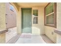 Welcoming front door area with a 'Welcome' mat and natural light at 40262 W Molly Ln # 138, Maricopa, AZ 85138