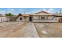 Delightful single-level home featuring a charming red tile roof, a garage, and a convenient driveway at 4335 W Monterey Way, Phoenix, AZ 85031