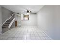 Bright living room featuring tile flooring and staircase access to upper level at 4608 W Maryland Ave # 122, Glendale, AZ 85301