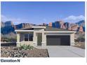 Charming single-story home featuring a two-car garage and desert landscaping against a scenic mountain backdrop at 4919 S 106Th Ave, Tolleson, AZ 85353