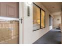 Exterior facade of unit showing front door, with secure screen door, and windows providing lots of light at 5518 E Lindstrom Ln # 2038, Mesa, AZ 85215