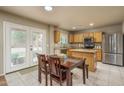 Eat-in kitchen features oak cabinets, granite countertops and stainless steel appliances at 23217 N 22Nd Pl, Phoenix, AZ 85024