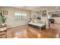 Open-concept living area with hardwood floors and a large window for natural light at 23217 N 22Nd Pl, Phoenix, AZ 85024