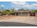 Charming single-story home featuring a covered carport, easy to maintain landscaping, and a welcoming brick pathway at 3224 W Ironwood Dr, Phoenix, AZ 85051