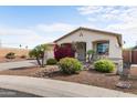 Single-story home boasts desert landscaping, a two-car garage, and a welcoming front porch at 3253 N 138Th Ave, Avondale, AZ 85392