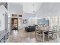Bright, airy living room featuring high ceilings, tile flooring, and multiple windows at 5755 W Harrison St, Chandler, AZ 85226