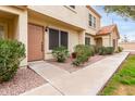 Inviting townhome entrance featuring well-kept landscaping and a cozy, welcoming atmosphere at 5808 E Brown Rd # 42, Mesa, AZ 85205