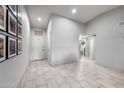 Bright foyer featuring tile flooring and modern decor at 6225 W Mary Jane Ln, Glendale, AZ 85306