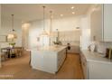 Bright, open kitchen featuring a large island, stainless appliances, and sleek cabinetry at 6232 E Monte Cristo Ave, Scottsdale, AZ 85254