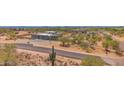 Expansive aerial view of desert home, showcasing its surroundings and ample space at 7261 E Via Dona Rd, Scottsdale, AZ 85266
