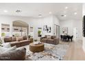 Bright living room boasts recessed lighting, neutral tones, and an open floor plan at 7717 E Black Rock Rd, Scottsdale, AZ 85255