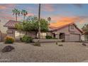 Charming single-story home displaying desert landscaping, and an inviting front entrance at 10563 E Bella Vista Dr, Scottsdale, AZ 85258