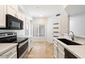 Bright kitchen with white cabinets, modern appliances, and ample counter space offers a sleek design at 11260 N 92Nd St # 1014, Scottsdale, AZ 85260