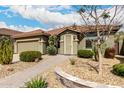 Inviting single-story home with desert landscaping and a cozy front porch at 11352 E Starkey Ave, Mesa, AZ 85212