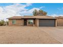 Cozy single-story brick home boasting a two-car garage and desert landscaping in a quiet neighborhood at 1201 S 80Th St, Mesa, AZ 85209