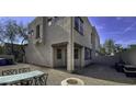 Townhome back patio with outdoor seating, stone pavers, and gravel landscaping at 1943 E Hayden Ln # 103, Tempe, AZ 85281