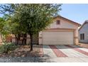 Charming single-story home with a two-car garage and well-manicured desert landscaping at 219 E Valley View Dr, Phoenix, AZ 85042