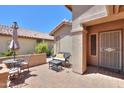 Cozy outdoor patio with brick flooring, comfortable seating, and shaded area perfect for relaxing at 2416 E Santiago Trl, Casa Grande, AZ 85194