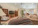 Bright living room with tile flooring, a green front door, and comfortable seating arrangements at 2416 E Santiago Trl, Casa Grande, AZ 85194