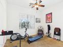 Workout room featuring exercise equipment, ceiling fan, and natural light at 264 S San Luis Rey Trl, Casa Grande, AZ 85194