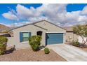 Cozy single-story home with blue garage door, shutters, and a low maintenance desert landscape at 34210 N Beeblossom Trl, San Tan Valley, AZ 85144