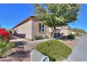 Well-maintained side yard with desert landscaping and a view of the home's exterior at 391 N San Ricardo Trl, Casa Grande, AZ 85194