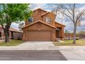 Inviting two-story home featuring a tidy lawn and a convenient two-car garage at 4053 W Quail Ave, Glendale, AZ 85308