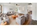 Bright living room features a modern ceiling fan, comfortable seating, and an open layout perfect for entertaining at 4360 E Sierrita Rd, San Tan Valley, AZ 85143