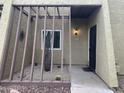 Inviting condo entrance with stylish desert landscaping and a secure black iron gate at 607 W 14Th St, Tempe, AZ 85281