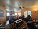 Inviting living room flows into the kitchen, filled with natural light and comfortable seating at 650 N Hawes Rd # 4326, Mesa, AZ 85207