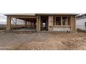 A framed view of the home with the framing nearly completed with a garage at 9548 W Parkway Dr, Tolleson, AZ 85353