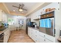 A view of the kitchen including the stove, countertops, and a breakfast nook at 10443 W Loma Blanca Dr, Sun City, AZ 85351