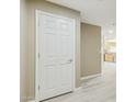 Hallway with white painted door that complements the light, neutral paint and bright flooring at 14000 N 94Th St # 2144, Scottsdale, AZ 85260