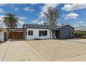 Stylish single-story home featuring a convenient carport and desert landscaping at 1621 W Mulberry Dr, Phoenix, AZ 85015