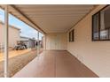 Spacious carport with direct access to the home's entrance and additional storage at 17200 W Bell Rd # 77, Surprise, AZ 85374