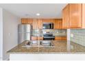 Well-equipped kitchen with stainless steel appliances and granite countertops for modern living at 200 E Southern Ave # 117, Tempe, AZ 85282