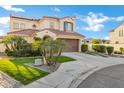 Well-manicured home exterior with lawn, decorative trees and large driveway leading to a two-car garage at 2395 W Riverside St, Chandler, AZ 85248