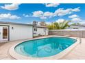 Backyard view features an in-ground pool surrounded by a concrete patio at 3021 N Randolph Rd, Phoenix, AZ 85014