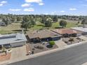 Desirable neighborhood with mature trees, showcasing the home's proximity to a lush golf course at 4055 E Catalina Cir, Mesa, AZ 85206