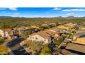Panoramic aerial shot showcases a vibrant community with well-maintained homes under a beautiful blue sky at 4611 E Casitas Del Rio Dr, Phoenix, AZ 85050