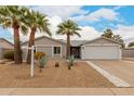 Charming single-story home featuring desert landscaping and a two-car garage at 4739 W Paradise Ln, Glendale, AZ 85306